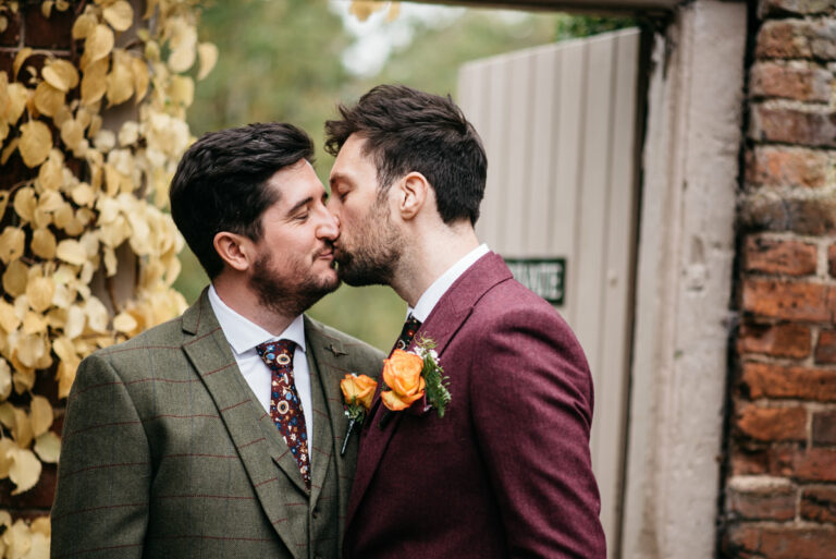 Couples photo in the garden gateway at Pim Hill Barn