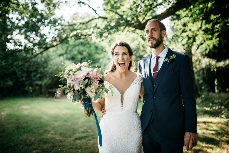 Bride and groom in the grounds of Yeldersley Hall celebrating their DIY wedding day